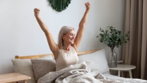 older woman waking up with a lot of energy