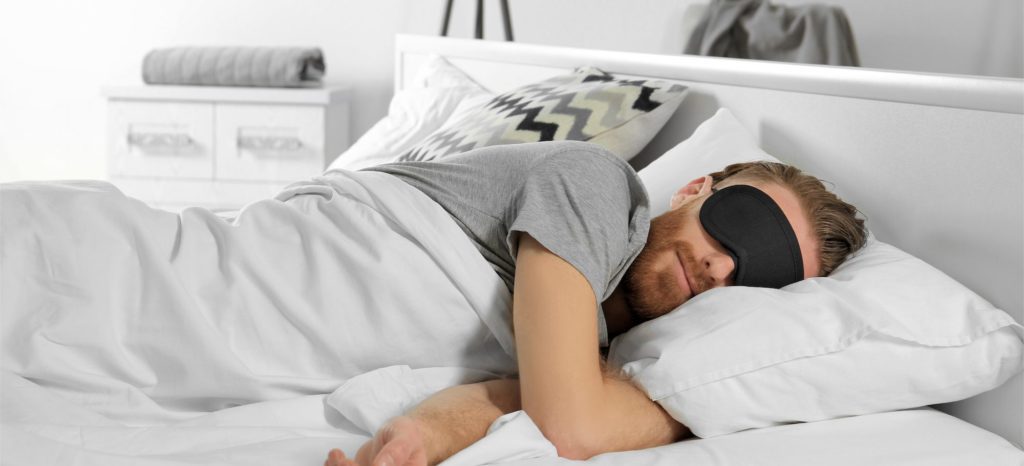 Stock image of a man sleeping during the day