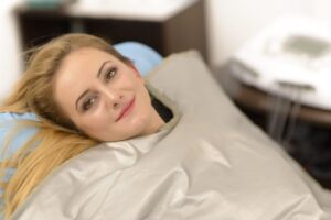 stock image of a woman with a weighted blanket