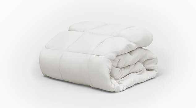 product image of the Saatva All-Year Down Alternative Comforter folded