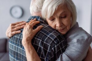 stock photo of an elderly couple embracing