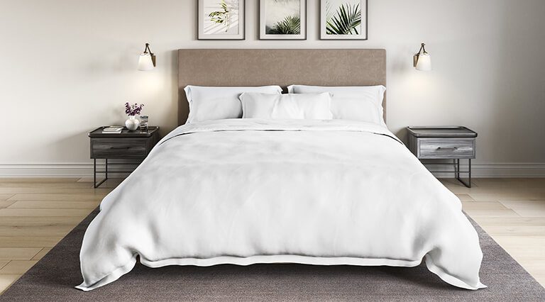 product image of the Saatva Organic Sateen Duvet Cover Set staged in a bedroom