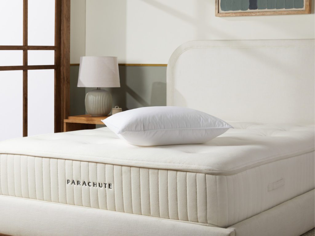 product image of the Parachute Down Pillow on a mattress