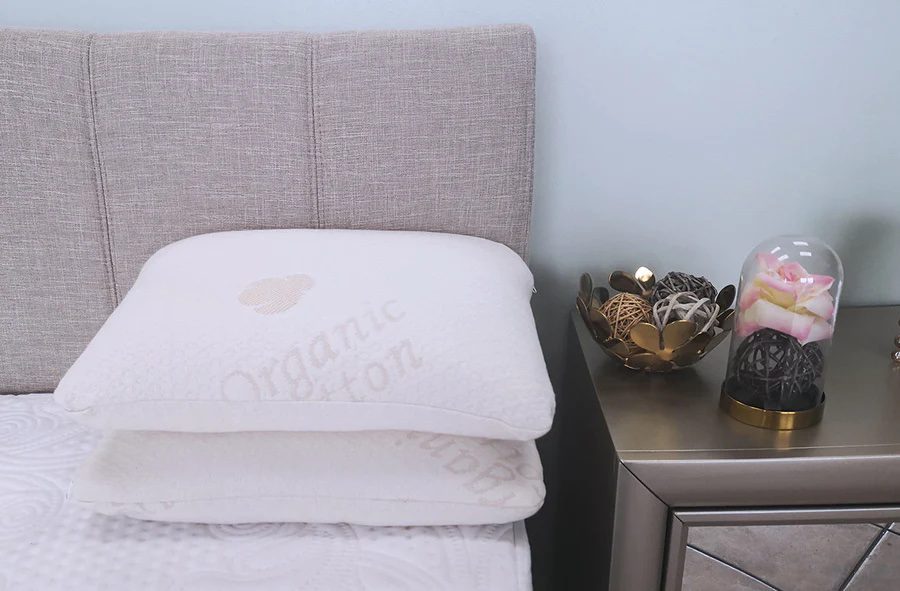 product image of two Sweet Zzz Buckwheat Pillows on a mattress